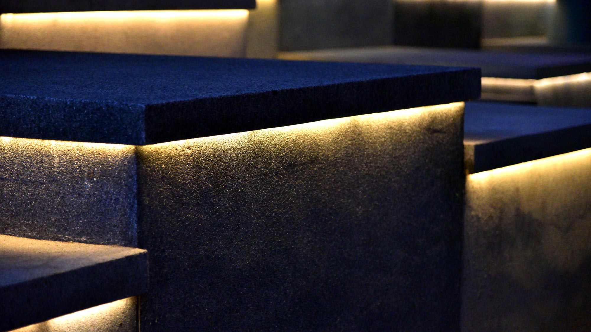 strip lighting beneath outdoor stone fixtures